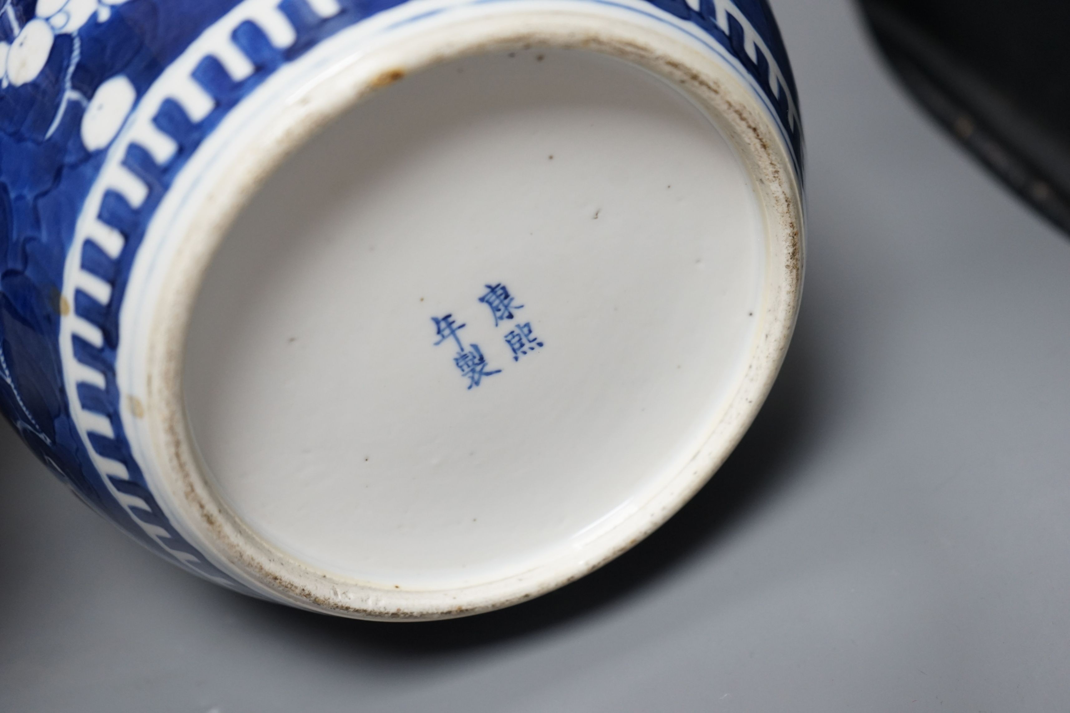 Two Chinese 20th century prunus jars and covers, 27cms high